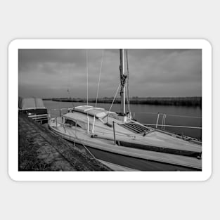 Boat moored up on the River Yare in Acle in the heart of the Norfolk Broads Sticker